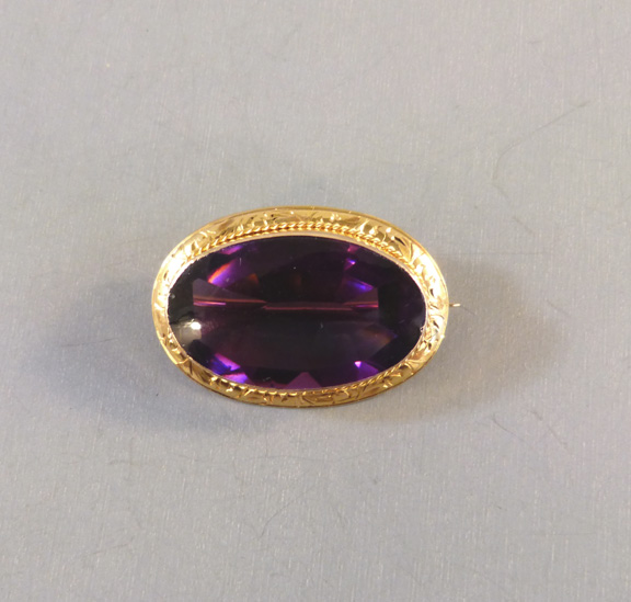 purple brooch