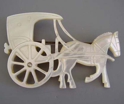 MOTHER-OF-PEARL carved carriage and horse brooch, 2-2/3".