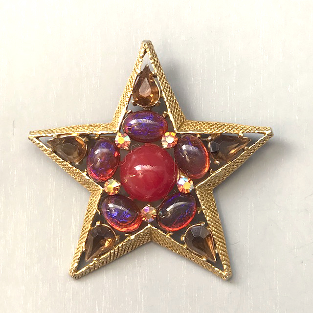 CAPRI star brooch with dragon s breath cabochons caramel teardrop shaped rhinestones and rose colored aurora borealis Morning Glory Jewelry Antiques